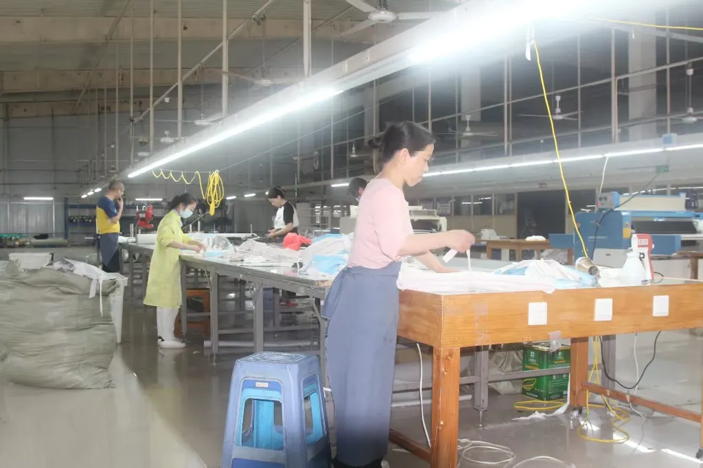Workers assembling garments at KEEP MOVING